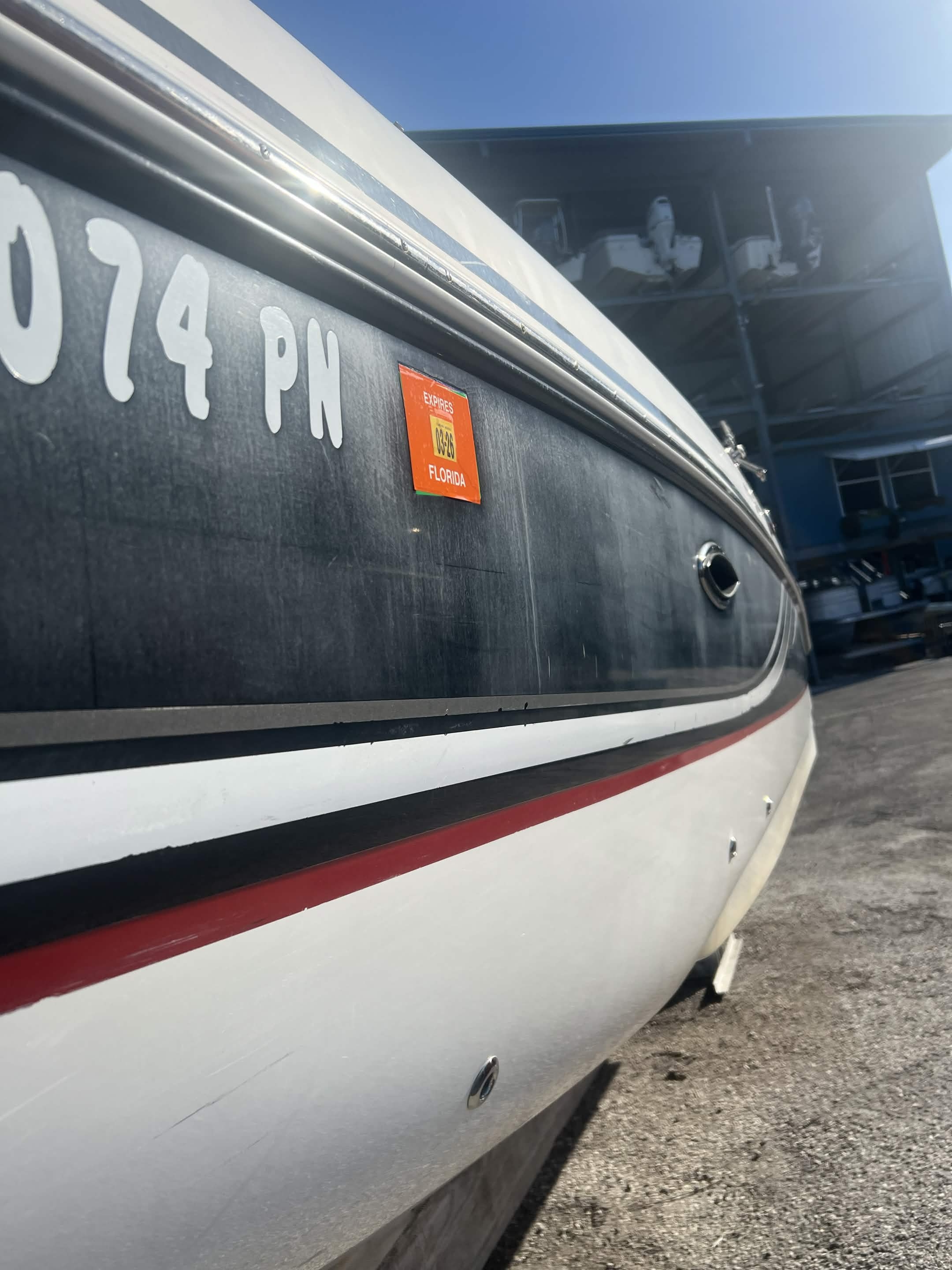 Boat hull before wet sanding in Tarpon Springs