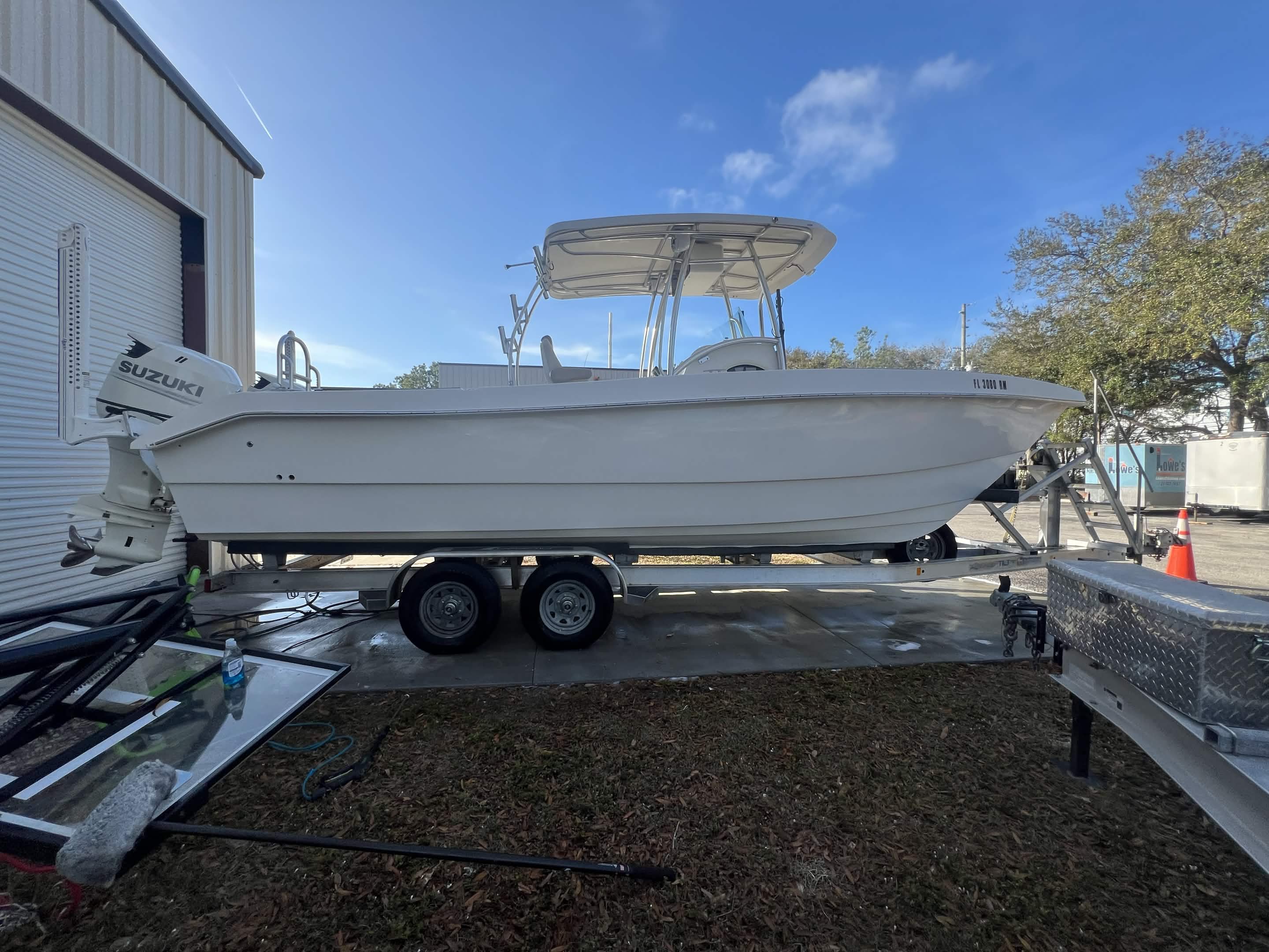Boat hull before marine protection film in Tarpon Springs